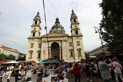 Front photo of St. Stephen's Basilica and lots of festival visitors on the square in front of it