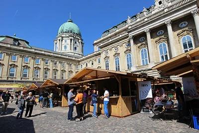 the cobble-stoned courtyard of the National Gallery lined with wine exhibitors' wooden booths