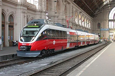 a red and white inetrcity train in Budapest's Keleti Railway Station