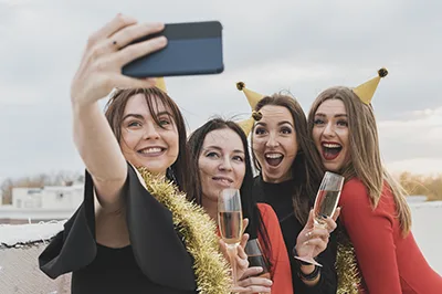 4 girls partying on a cruise and taking  a selfie