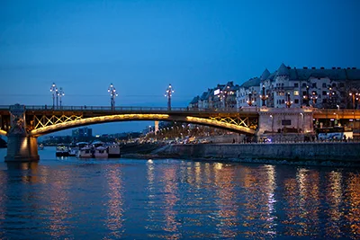 view of Margaret Bridge over the Danube in Budapest photographed from a cruise ship at the blue hour
