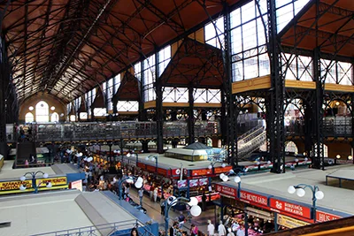 the ground floor of the Great Market Hall - the iron structured roof and large industrial windows are visible