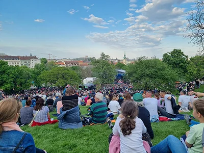 people sitting on the lawn in Tabán on May Day in Budapest