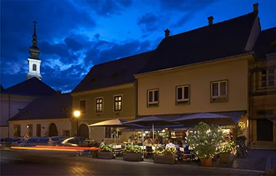 the terrace of the 21 Magyar Restaurant in Buda Castle at twilight