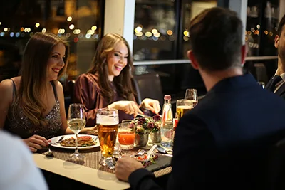 young people having dinner at a cruise ship