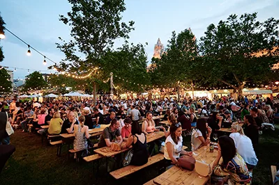 festival goers having great time in the evening at the Wine & Champagne Festival on Liberty Sqr Budapest