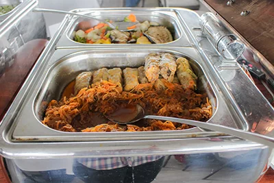 stuffed cabbage rolls in a stainless steel food warmer