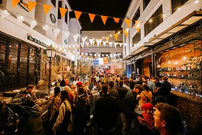 people on the French Food Fest in Kazinczy Street Budapest at night