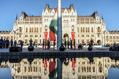 soldiers marching in front of the Parliament, and preparing for raising the Hungarian national flag