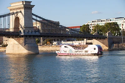 The Wiking sightseeing boat at the Cahin bridge on the Danube