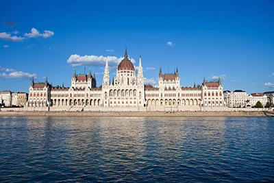 The Hungarian parliament building from a boat on the Danube on a slightly cloudy summer afternoon