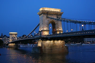 the Chain Bridge in Budapest with the lights on at the blue hour