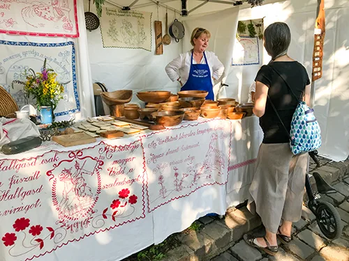 wooden utensils and embridery at a booth on the Folk Craft Festival in Buda castle