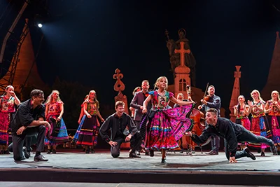 folk dance performance on the main stage of the festival at night