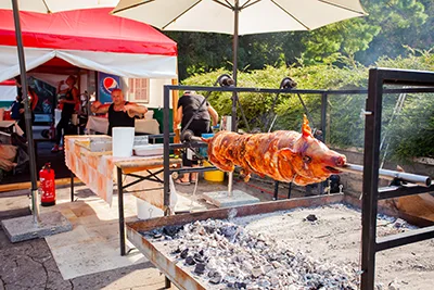 pig being roasted over open fire at the Street Of Hungarian Flavours gastro festival