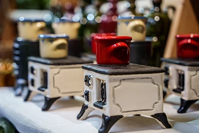 miniature traditional wood-fired white kitchen stoves