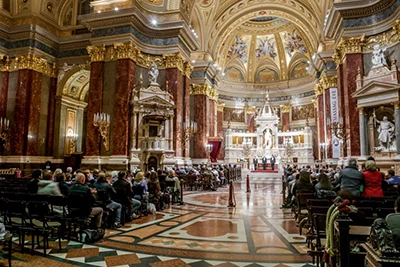 people listening to a concert in the Basilica of Budapest
