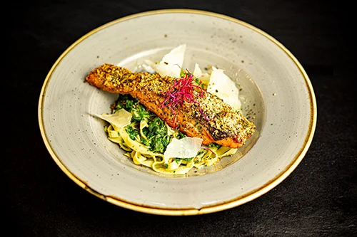 roasted fillet of salmon on bed of tagliatelle and spinach