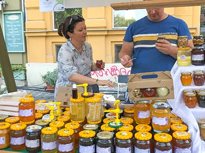 Vendors selling bottled honey at the Street Of Hungarian Flavors festival