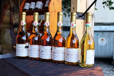 6 bottles of Tokaji aszu wine at a booth at the Budapest wine festival