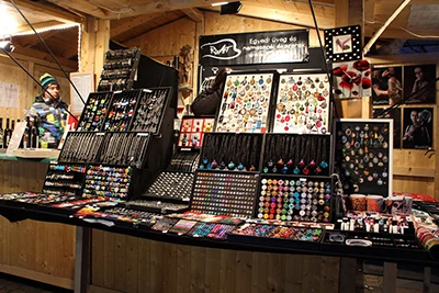 handcrafted jewelry on display at one of the wooden booths at the Xmas market by the Basilica