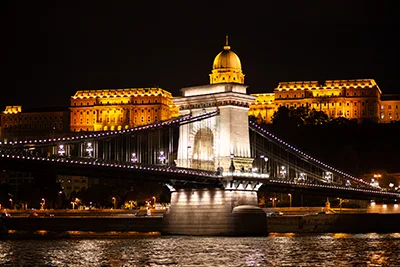 Chain Bridge and teh Royal Palace in Buda photographed on a Night Cruise on the Danube