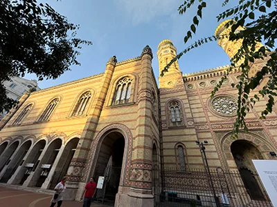 front view of the twin-tower Dohany Street Synagogue at the golden hour on n autumn day - both Jewish Budapest Tours include visiting it