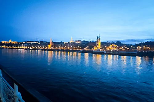View of the Buda side: Royal Palace, Matthias Church and other buildings illuminated at the blue hour