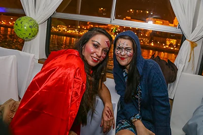 2 young women dressed in halloween costume on board a party cruise ship in Budapest