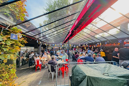 The glass roofes interior of Fröccsterasz packed with people on the beer festival