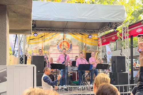 A Bavarian music band performing on the stage at the Froccsterasz location of Oktoberfest Budapest
