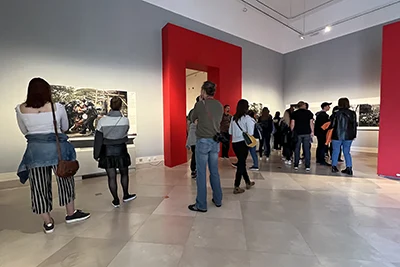 visitors viewing the exhibited photos on the World Press Photo exhibition