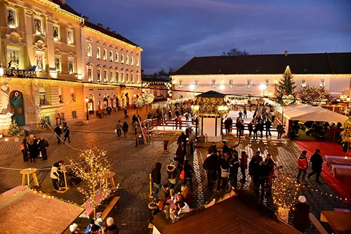 Christmas fair in Obuda at night, part of the ice rink is visible