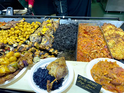 food offer at one of the wooden booths on the Xmas fair in Vörösmarty Sqr.