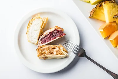 3 pieces of strudel with different fillings: apple, cottage cheese and sour cherry
