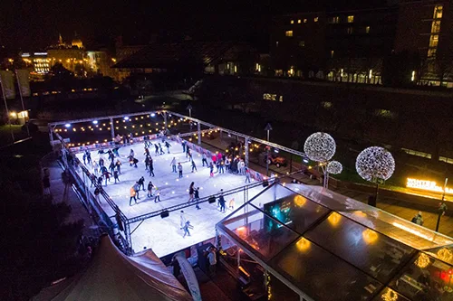 ice rink on the rooftop of the WestEnd mall illuminated at night