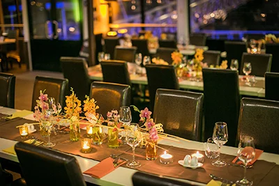 festively set tables on a cruise ship in Budapest at night