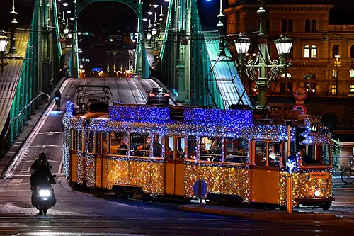 Tram 47 decorated with UV LED light strips on Liberty Bridge