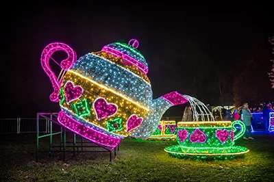the giant teacup from Allice in Wonderland in pink, blue, yellow and green LED light strings