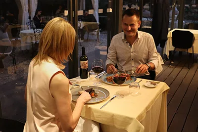 a couple having a dinner in Pavilion de Paris restaurant
