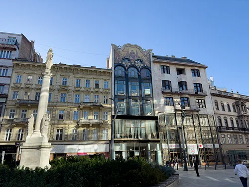 Historic building and statue in Servita Square