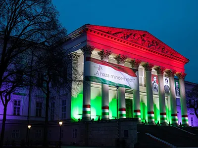 Light show in the red, white and green on the facade of the National Museum building