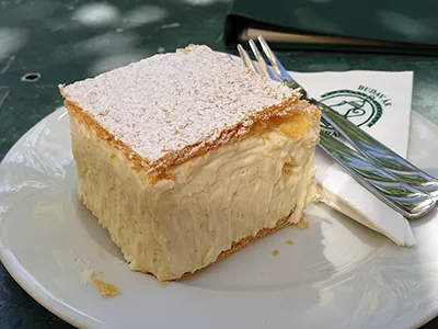 Kremes in Ruszwrum Cake shop: vanilla custard cream between two square shape layers of puff pastry