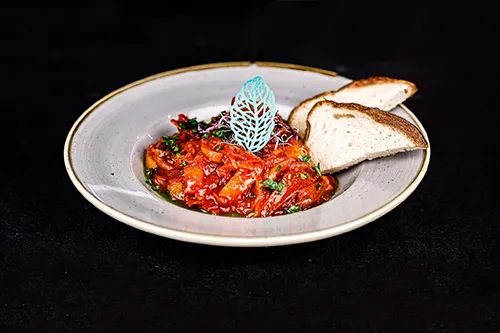 Hungarian ratatouille: veggie ragout made with bell pppers, tomato and onions, serve dwith 2 slices of white bread