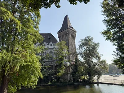 the tower of Vajdahunyad Castle and the lake in Ciyt park